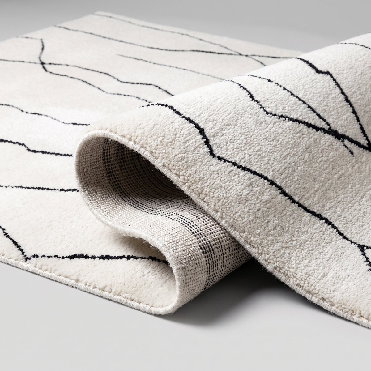 Angle et pli du tapis Grignan - détail du tissage