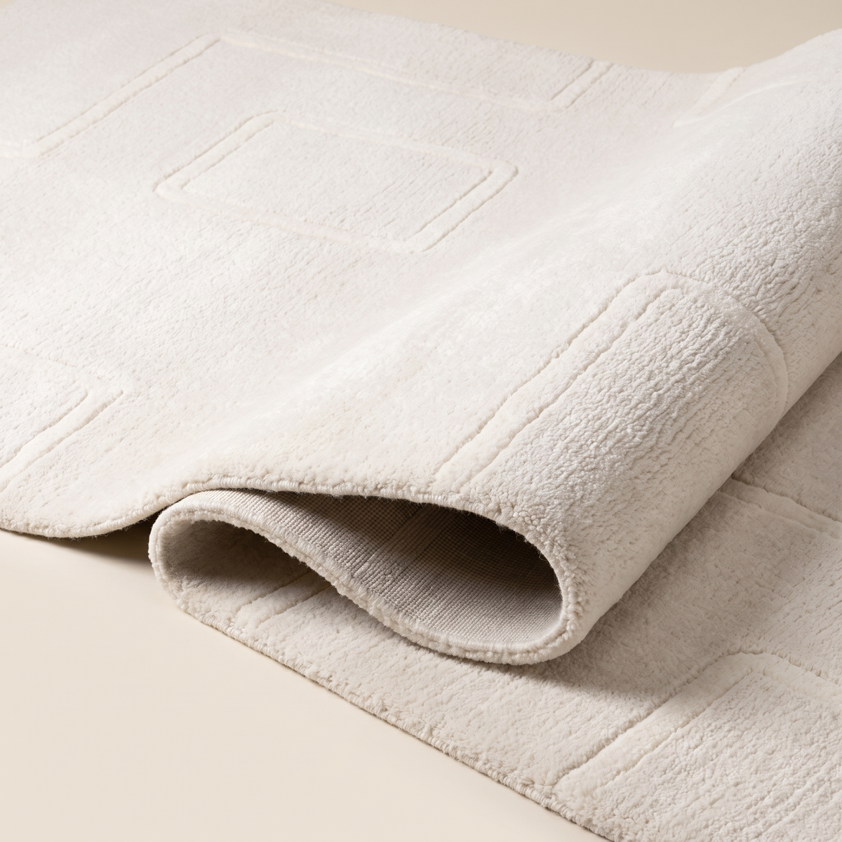 Angle et pli du tapis Nyons Neige - détail du tissage