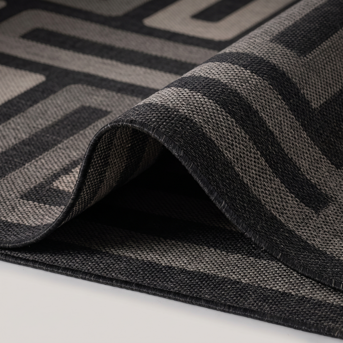 Angle et pli du tapis Bréhat Tonnerre - détail du tissage
