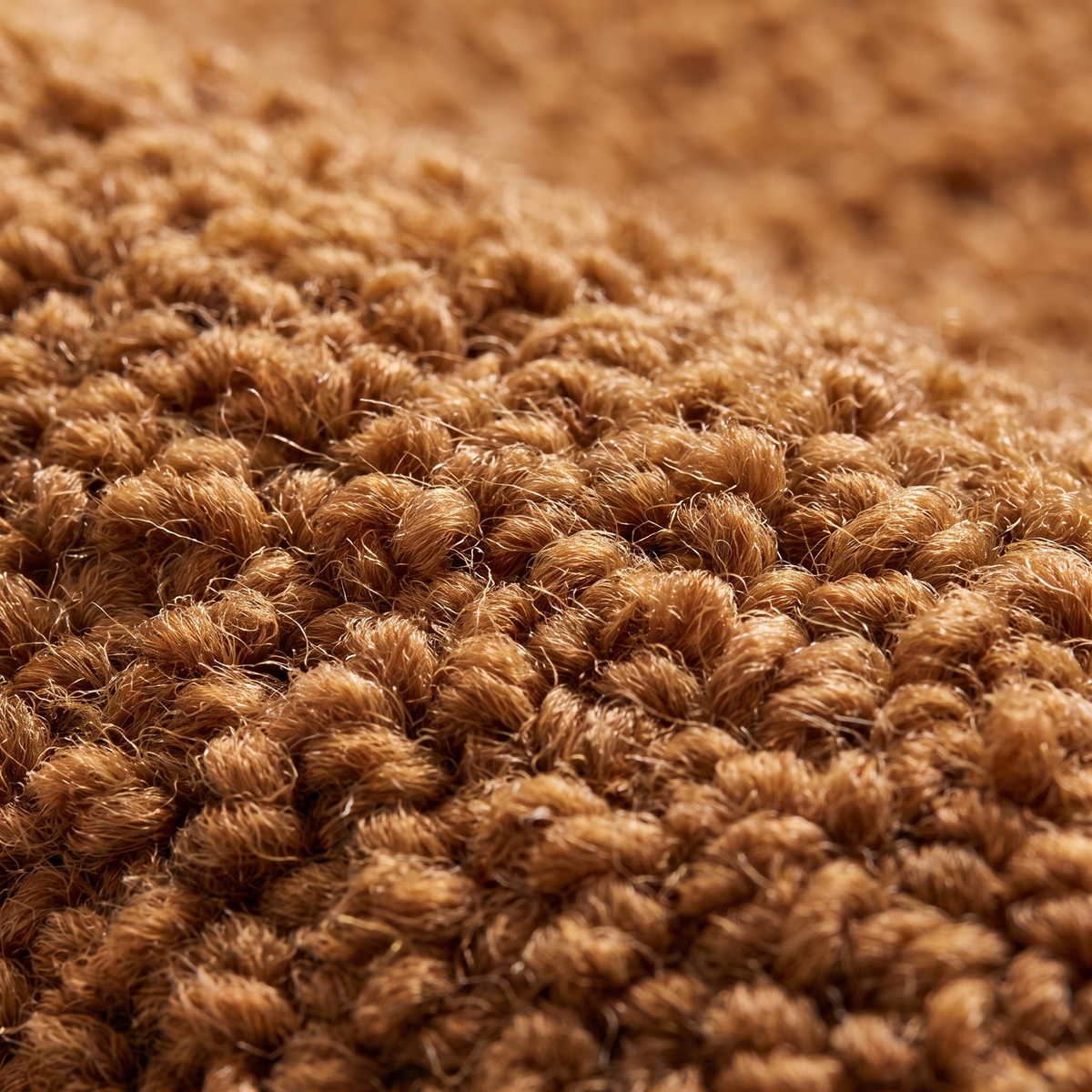 Zoom qualité du tissage du tapis Arradon Caramel