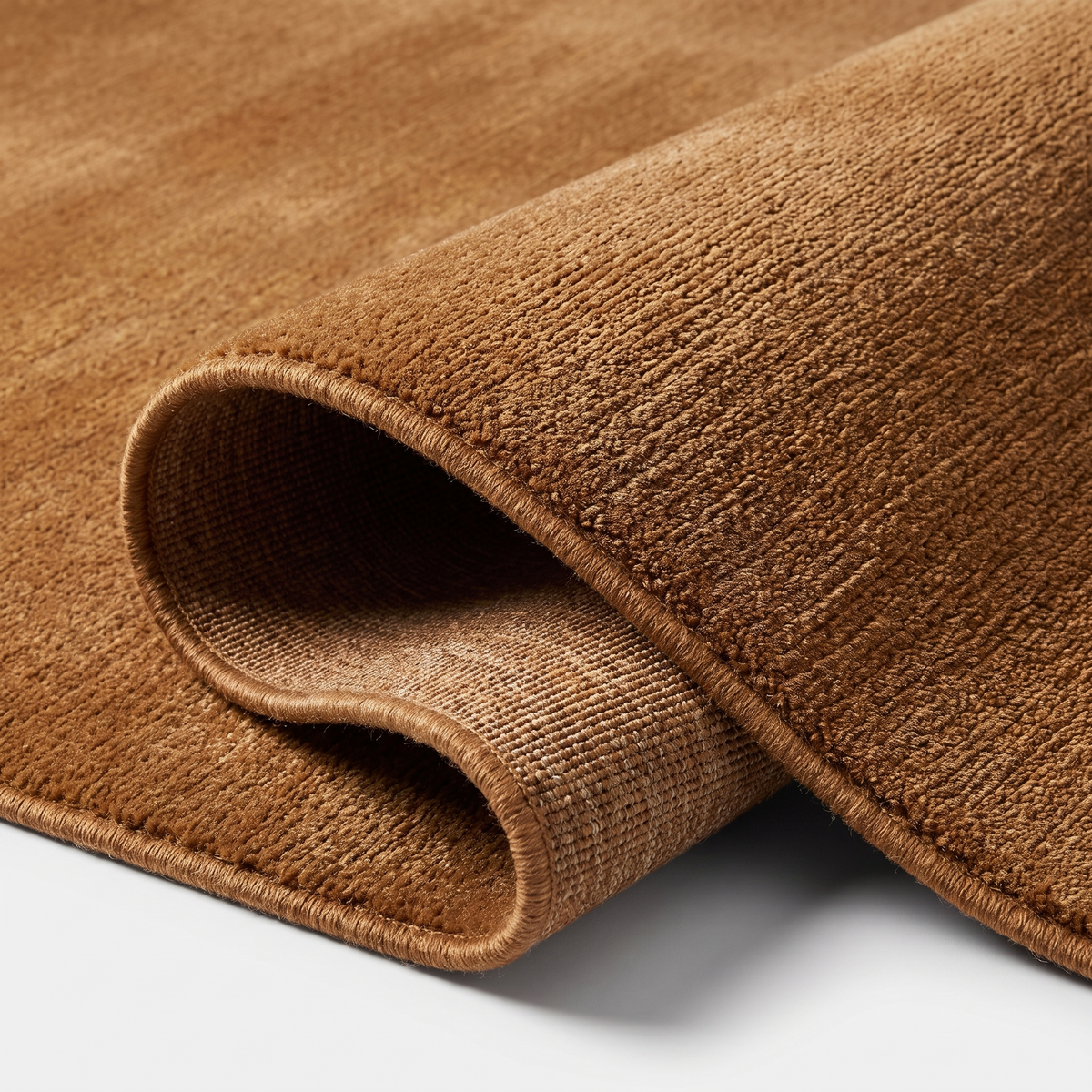 Angle et pli du tapis Arradon Caramel - détail du tissage