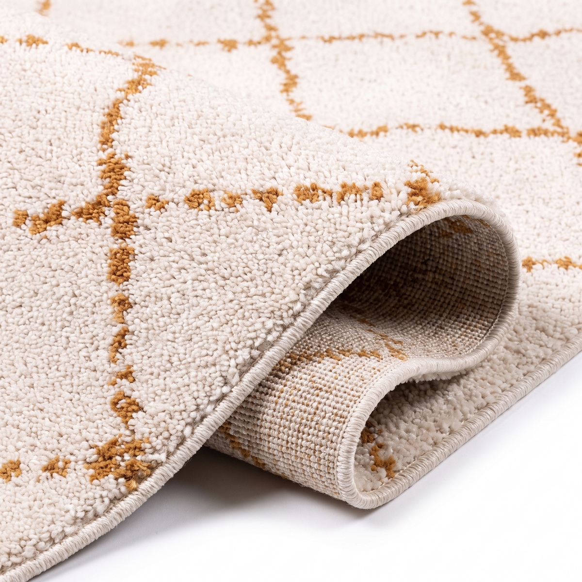 Angle et pli du tapis Larzac Cuivre - détail du tissage